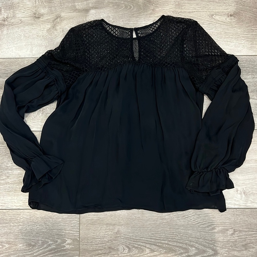 Beautiful Parker blouse with lacy top part, flouncy material.
